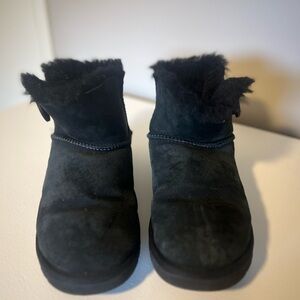 Black Mini Bailey Button Uggs size 9. Shows signs of wear.